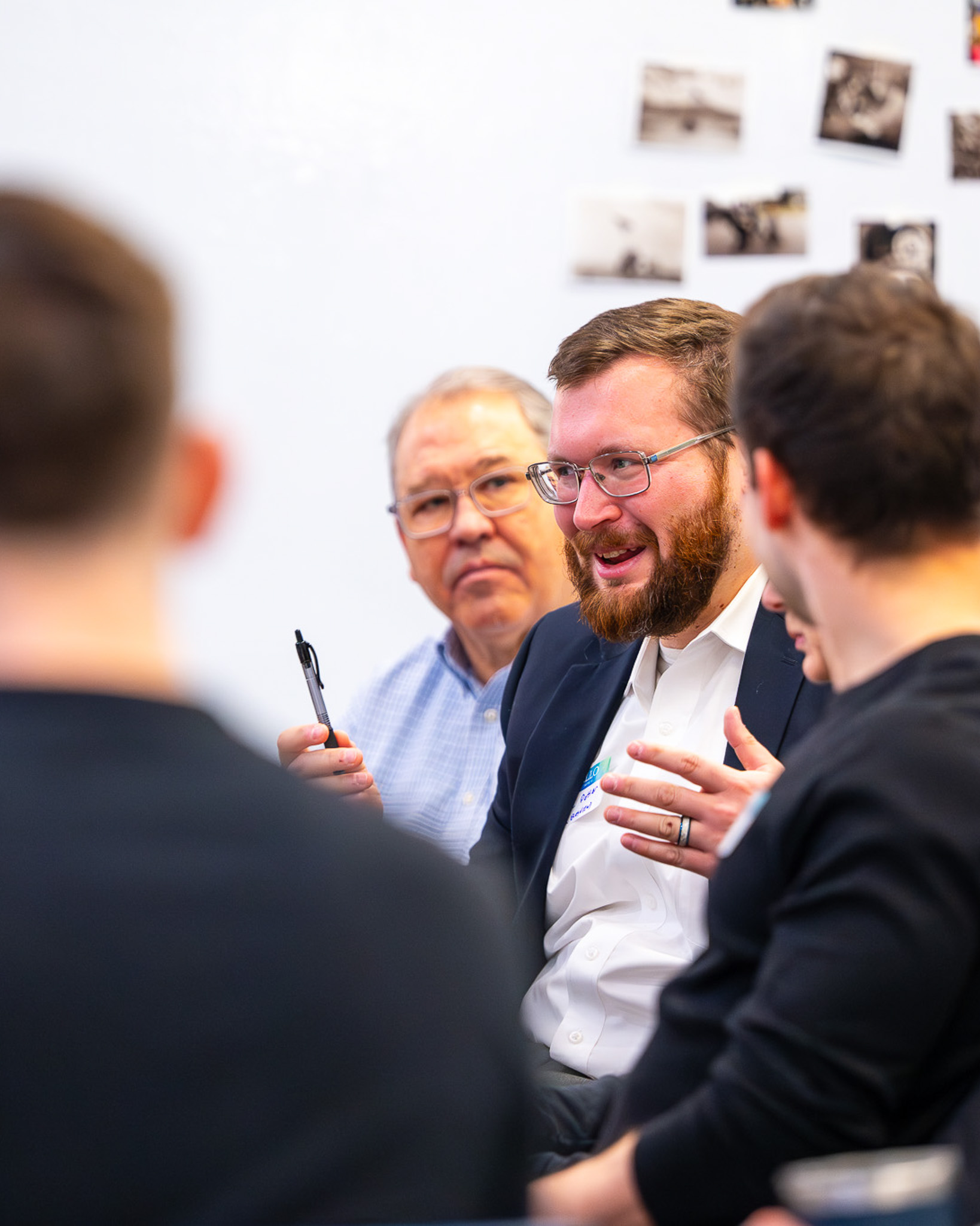 Attendees in conversation at a monthly networking event at the Hub